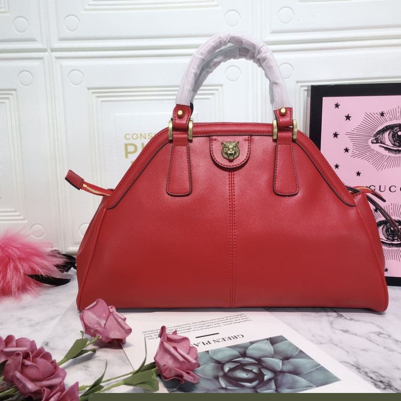 G*u*i top handle bags